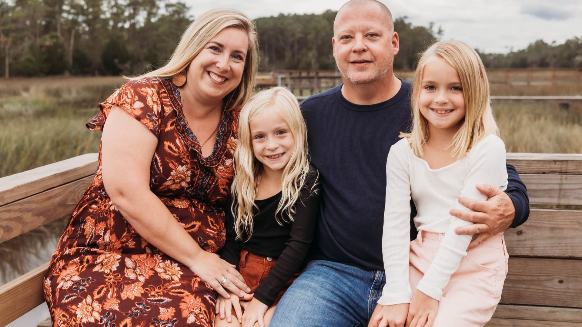Chris Alexander with his wife and daughters on a Lowcountry marsh dock in Charleston SC